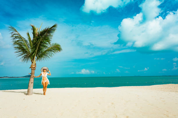 istock Woman at tropical beach 1140952367