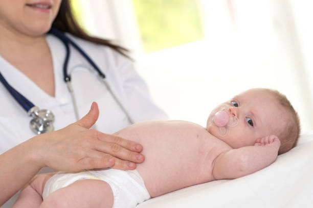 istock Pediatrician examining baby 1140952521
