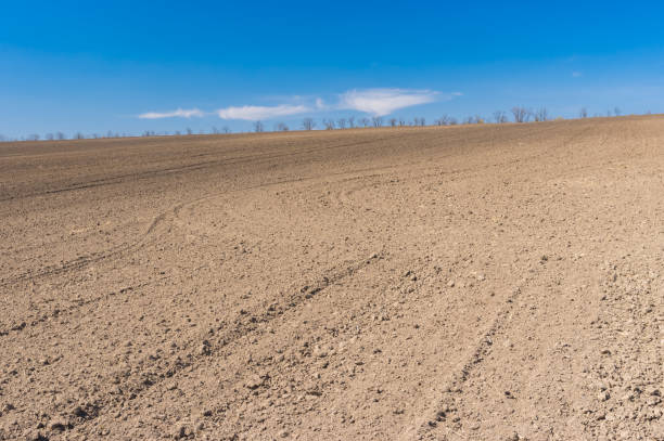 Spring landscape with soil prepared for crops sowing near Dnipro city, Ukraine - fotografia de stock