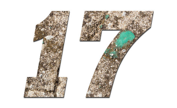 istock Number 17 with old wall on white background,Stone Number 1140959886