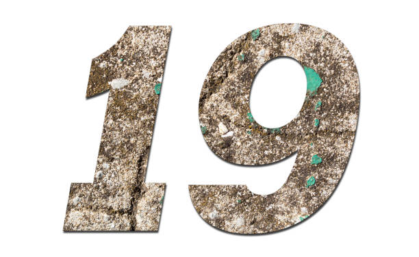 istock Number 19 with old wall on white background,Stone Number 1140959940
