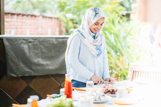 istock Young Asian Woman Preparing Meal for Lunch 1140960063
