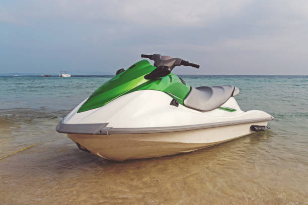 istock white-green jet ski parked on the shore 1140960101