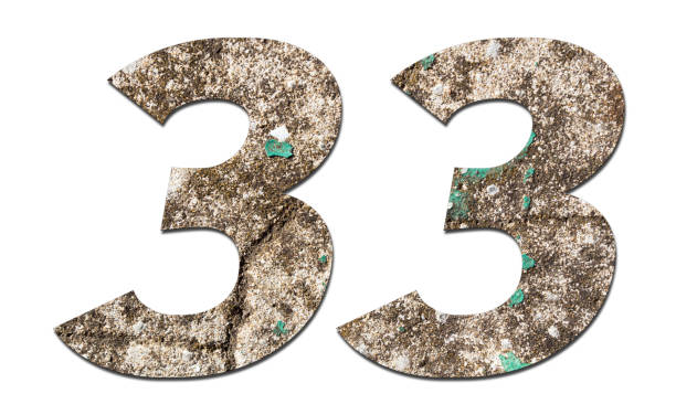 istock Number 33 with old wall on white background,Stone Number 1140960261