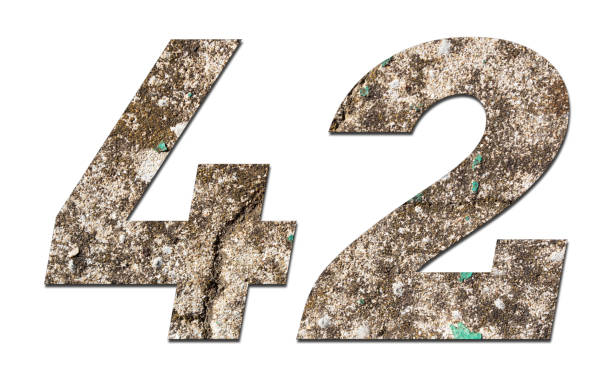 istock Number 42 with old wall on white background,Stone Number 1140960966