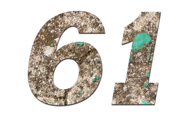 istock Number 61 with old wall on white background,Stone Number 1140961276