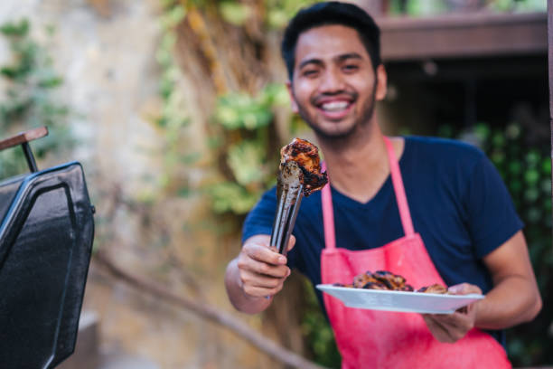 Preparing barbecue outdoors