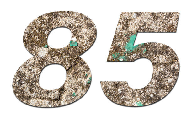 istock Number 85 with old wall on white background,Stone Number 1140962196