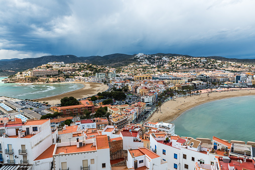 Aerial view of the fortified city and port of Peniscola (Peñíscola) in the Costa del Azahar in Castellón on a rainy day, Valencian Community in Spain.