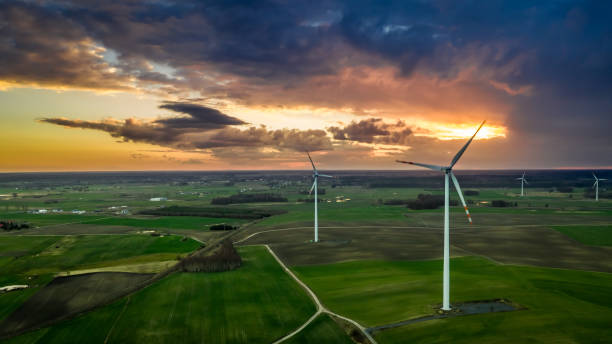 istock Flying above wonderful wind turbines at dusk 1140964267