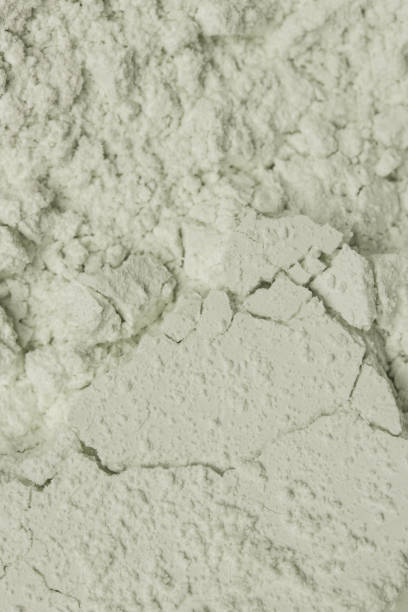 istock Green cosmetic clay powder textured background, close up, 1140964655