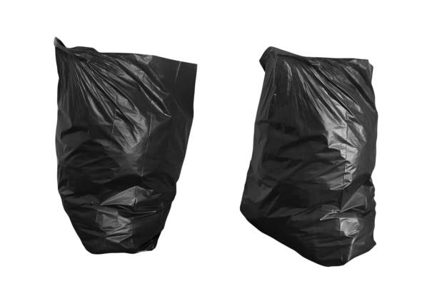 istock black garbage bag isolated on white background - clipping paths 1140965460