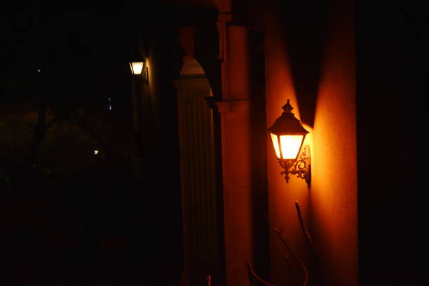 istock electric lamp on wall in the night 1140966485