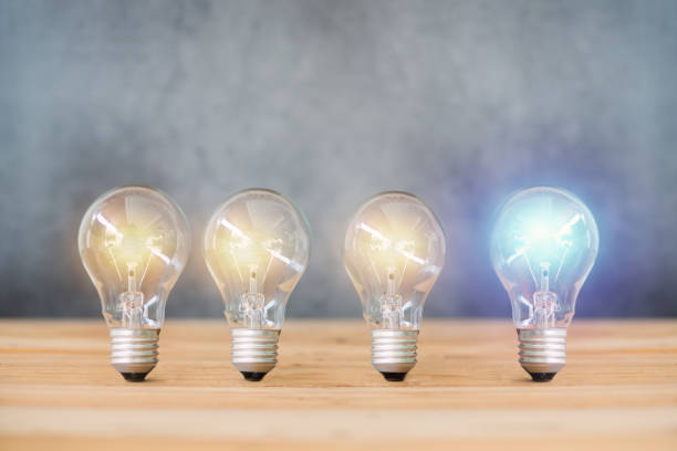 istock idea energy and light bulb on cement wall background 1140967489