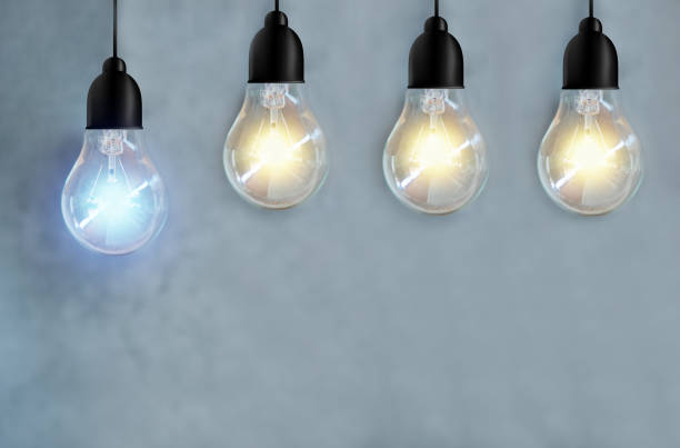 istock idea energy and light bulb on cement wall background 1140967494