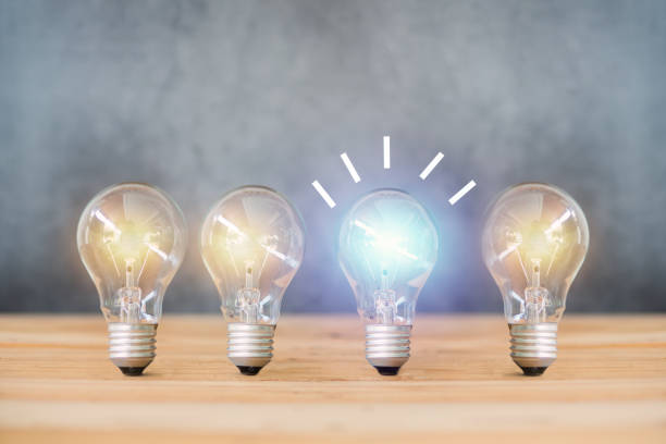 istock idea energy and light bulb on cement wall background 1140967496