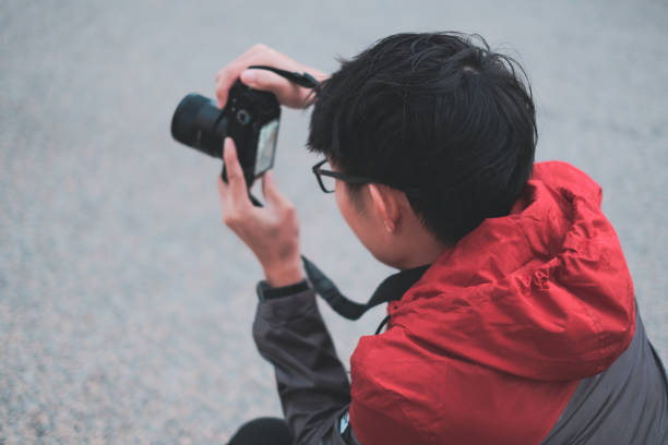 istock Young photographer take photos on street 1140967573