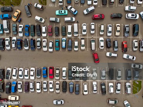 istock A view from above to the lines of parked cars. Heavy traffic in the parking lot. Searching for spaces in the busy car park. Cruising for parking in dormitory area. Difficulties of parking in the city 1140967887