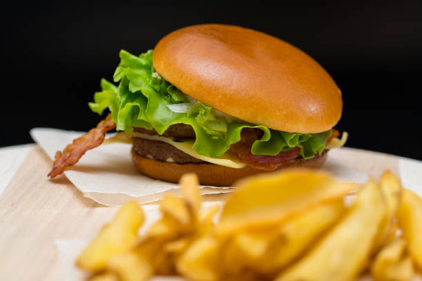 istock Bacon cheeseburger with French fries 1140968063