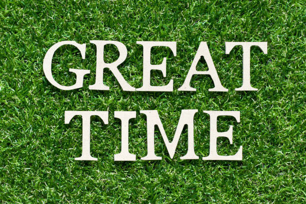 istock Wood alphabet letter in word great time on artificial green grass background 1140971292