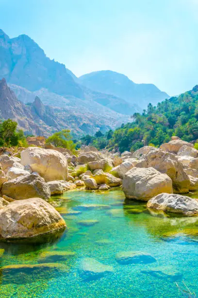 Lagoon with turqoise water in Wadi Tiwi in Oman.