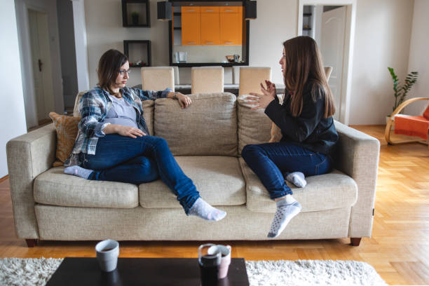 istock Serene deaf women enjoying a cup of coffee while having a sign language discussion 1140972289