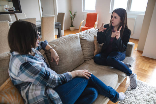 istock Deaf women communicating with hand signs at home 1140973325