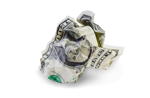 One crumpled dollar isolated on white background. Clipping path included