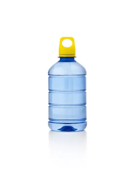 Photo of Water in plastic bottle on isolated white background