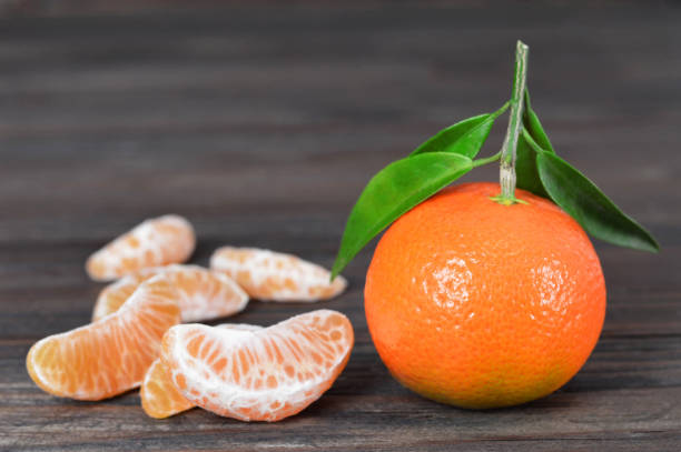 istock Mandarin on wooden background 1140979406