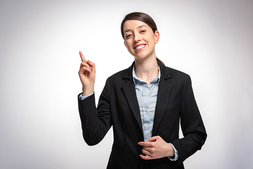Businesswoman pointing presenting