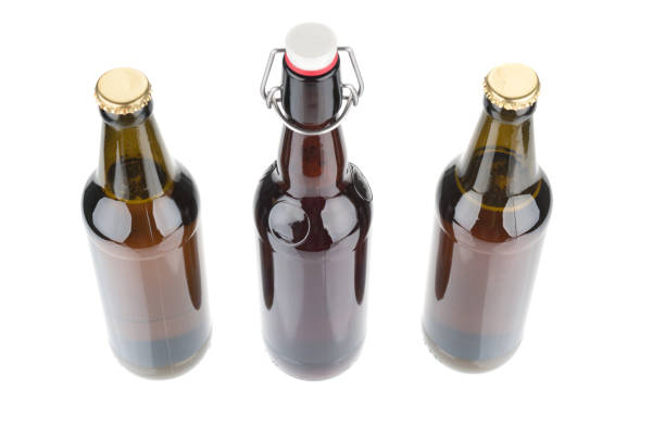 istock Top view on beer bottles close up on white background 1140980796