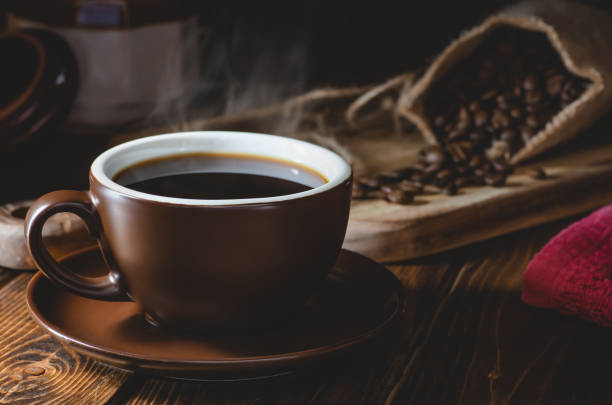 istock Hot Cup of Coffee on a Dark Background 1140981658