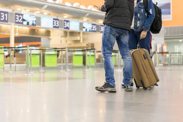 istock Passengers with a suitcase at the airport 1140981961