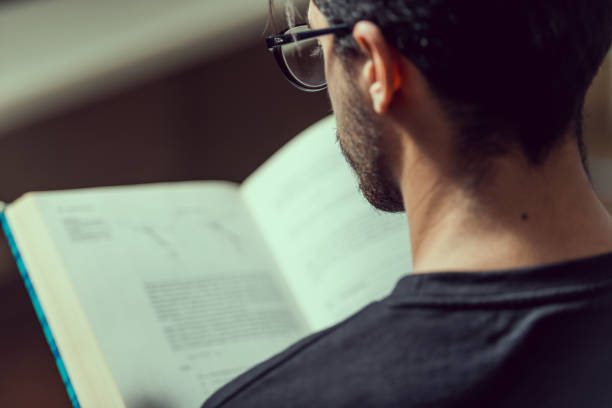 istock Young computer science student reads an advanced robotics book in Caceres, Spain. 1140981979