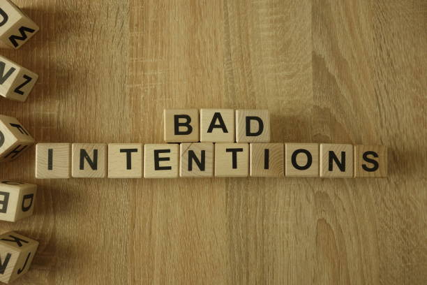 istock Bad intentions text from wooden blocks 1140982096