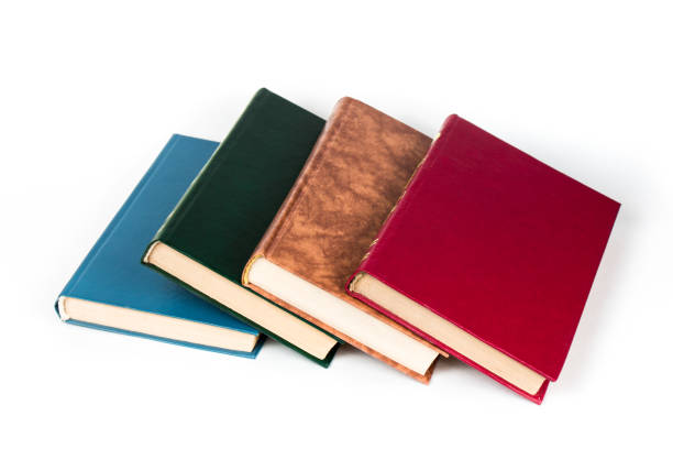 istock Multi-colored books lie chaotically in isolated on white background 1140982445