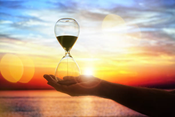 istock Hourglass at sunset concept for time passing 1140983352