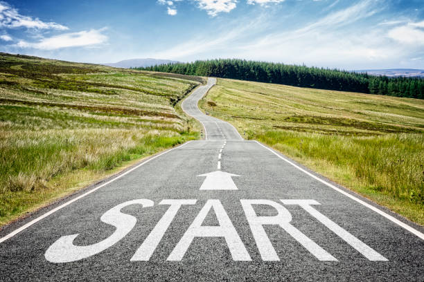 Start line on the road ahead disappearing into the distance Start line on the highway disappearing into the distance concept for business planning, strategy and challenge or career path, opportunity and change starting line stock pictures, royalty-free photos & images