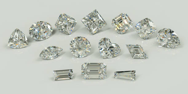 istock Fourteen fancy cut diamonds on white glossy background 1140984263