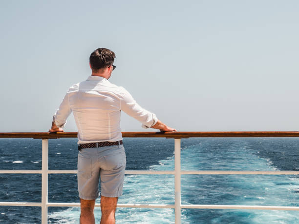 istock Man on the empty deck of a cruise liner 1140984615