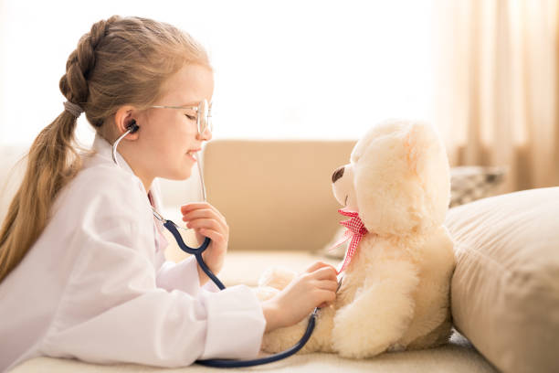 istock Girl playing doctor 1140984887
