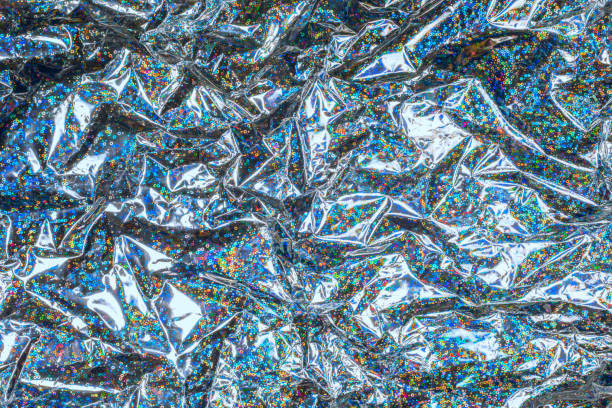 Holographic iridescent metallic wrapping foil radiant background