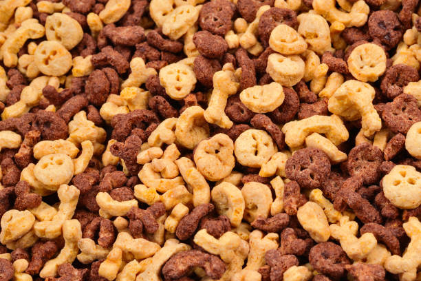 istock Chocolate flakes in the form of skulls and bones background. Top view. 1140987621