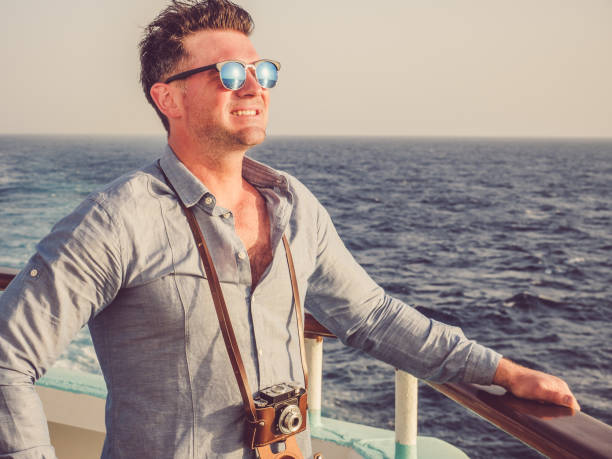 istock Man on the empty deck of a cruise liner 1140988016