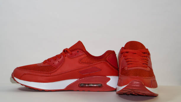 istock On a white background, red sneakers, with white sole, close-up 1140988019