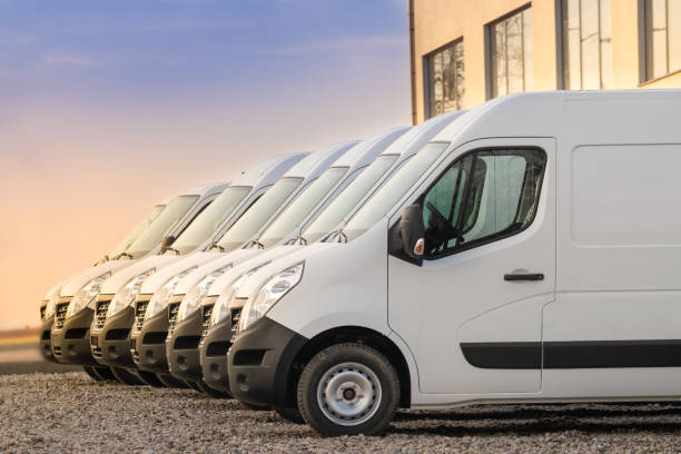 commercial delivery vans in row - transportation delivering land vehicle car imagens e fotografias de stock