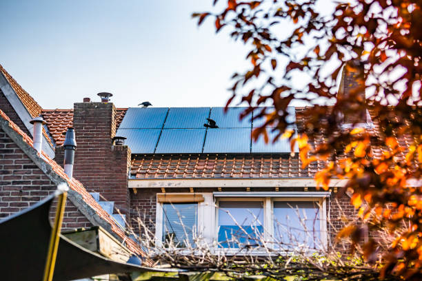 Solar panels on the slanted roof of a house Waalwijk, Noord Brabant, Netherlands - Solar panels on the roof of a house for green power and a better environment. berkel stock pictures, royalty-free photos & images