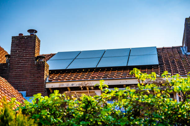 Solar panels on the slanted roof of a house Waalwijk, Noord Brabant, Netherlands - Solar panels on the roof of a house for green power and a better environment. berkel stock pictures, royalty-free photos & images