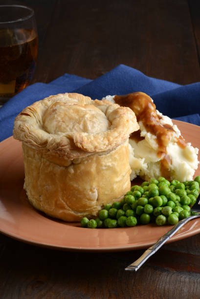 istock closeup pub meat pie with vegetables and gravy 1140989017